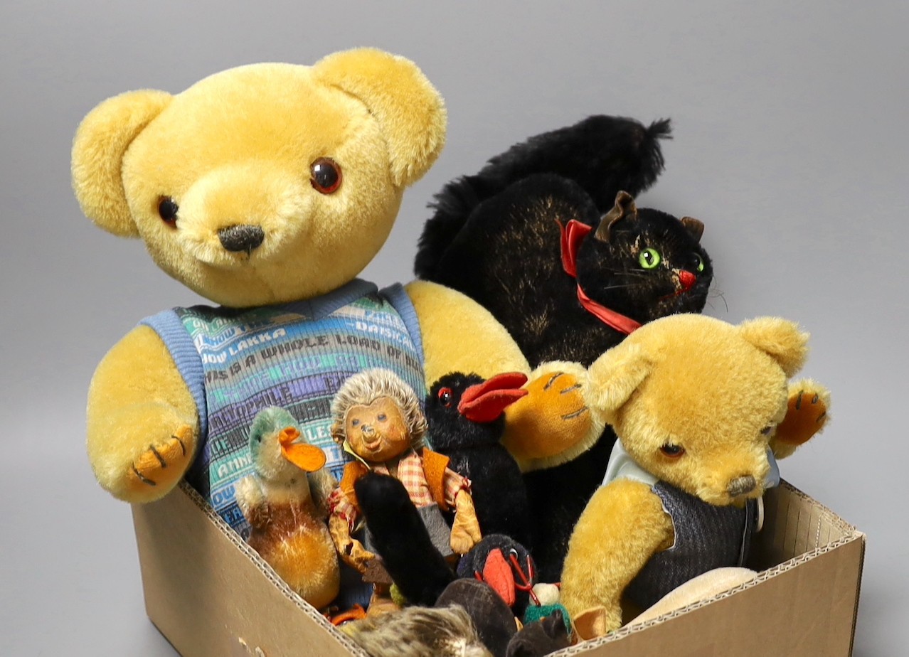 A collection of Steiff toys - a small black cat, a large black cat, a small pig, a hedgehog, a Macki hedgehog, two crows, a duck, two small birds with wire feet and two Peter Bull bears with pedigree certs. (12)